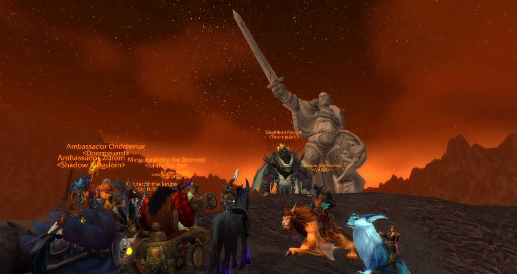 Da Doctas Tour pose at the base of the statue of King Anduin Lothar in the Burning Steppes.